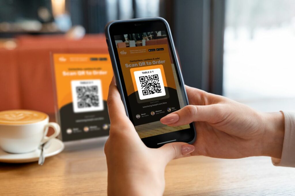 A person scanning a QR Code