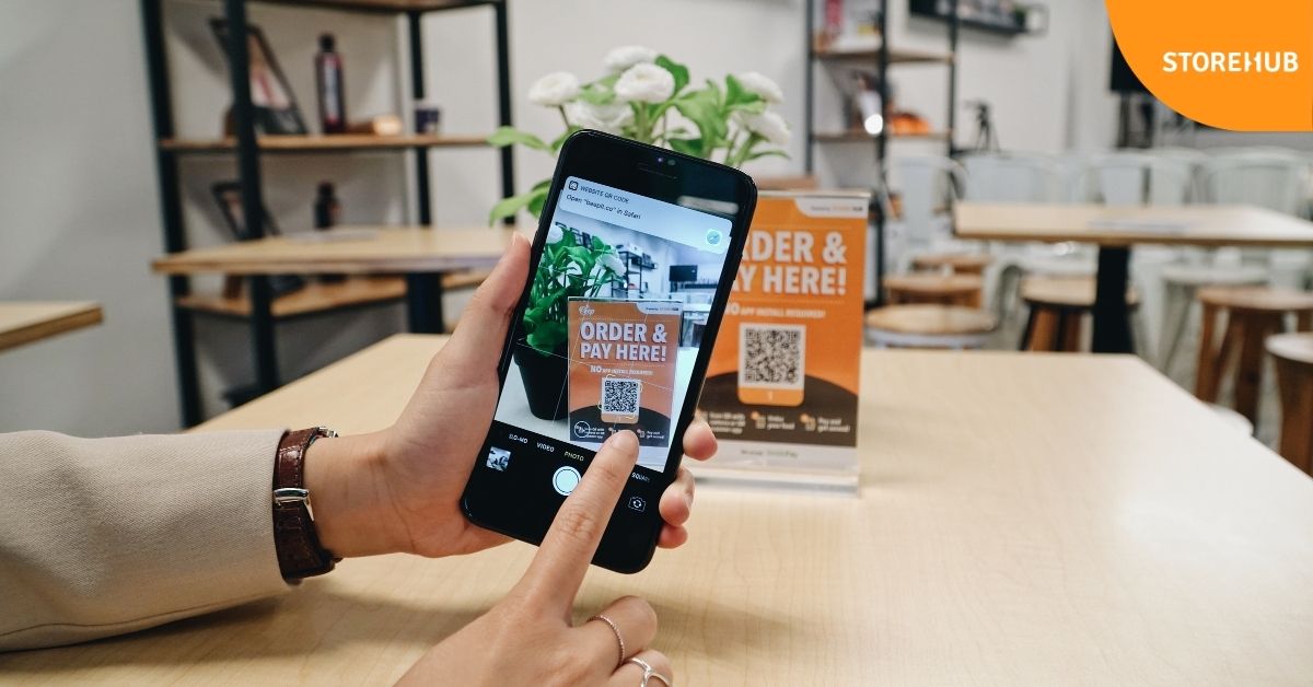 A person ordering food with Beep QR Order by StoreHub