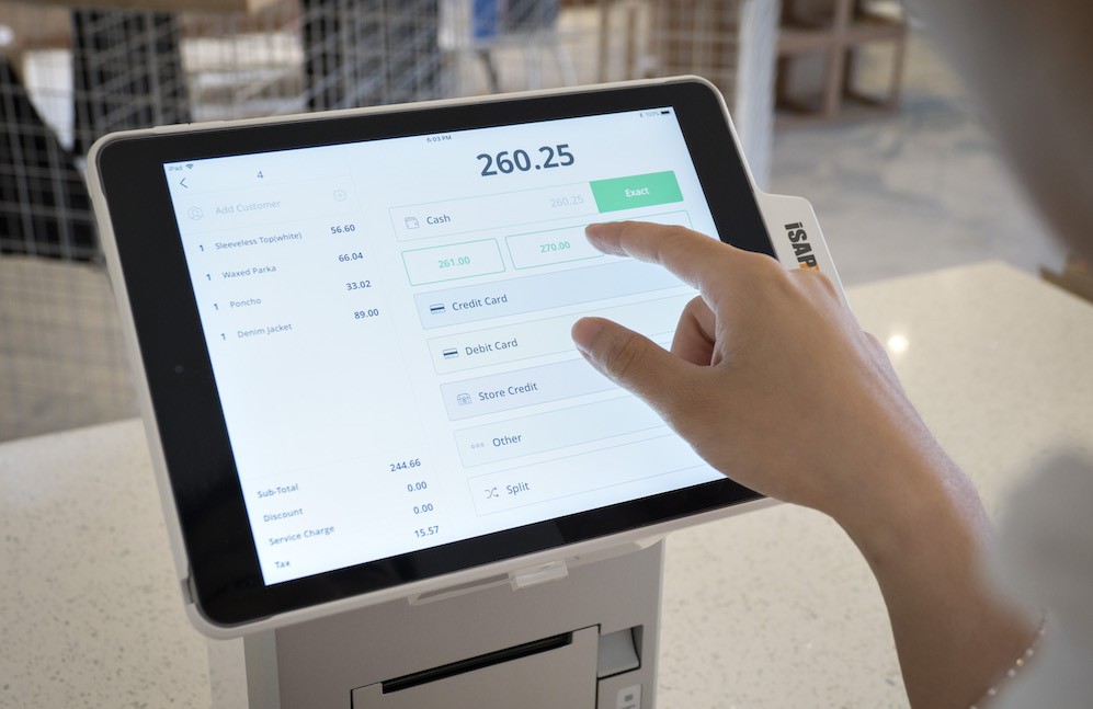 woman using StoreHub POS system