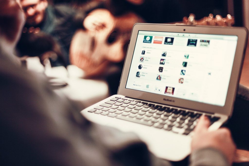 man-using-laptop-in-cafe