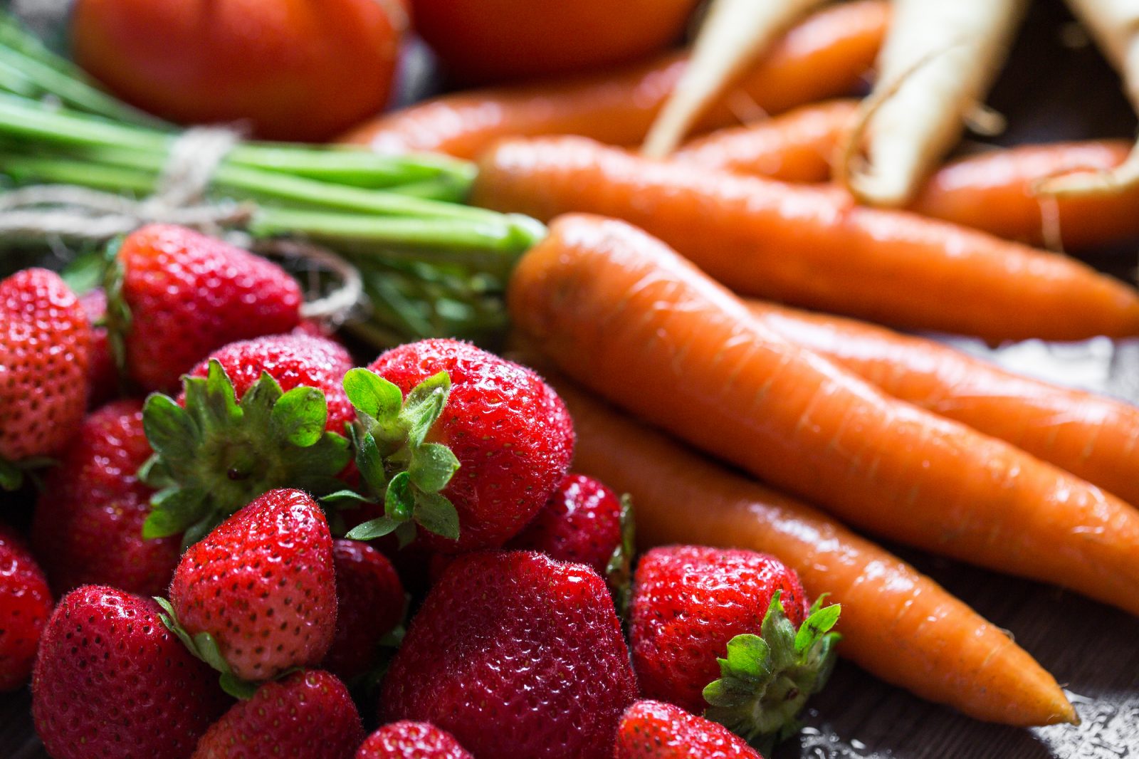 preparing strawberry carrot on table