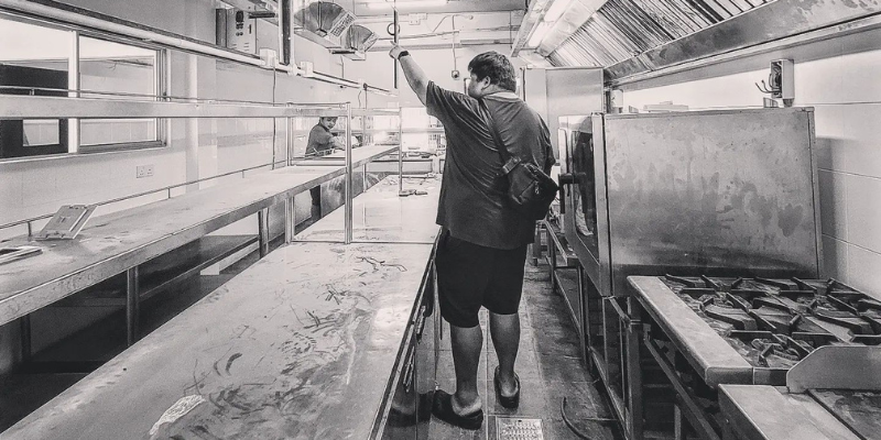 Ahong walking through the prep kitchen of Grub by Ahong & Friends located in Petaling Jaya