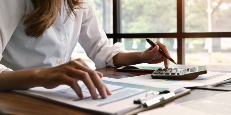 A Malaysian business owner doing accounting work