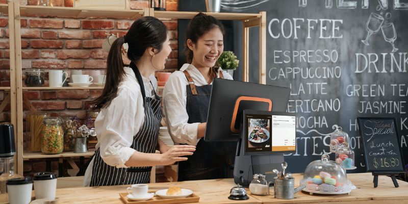 Malaysian restaurant staff operating a StoreHub POS system