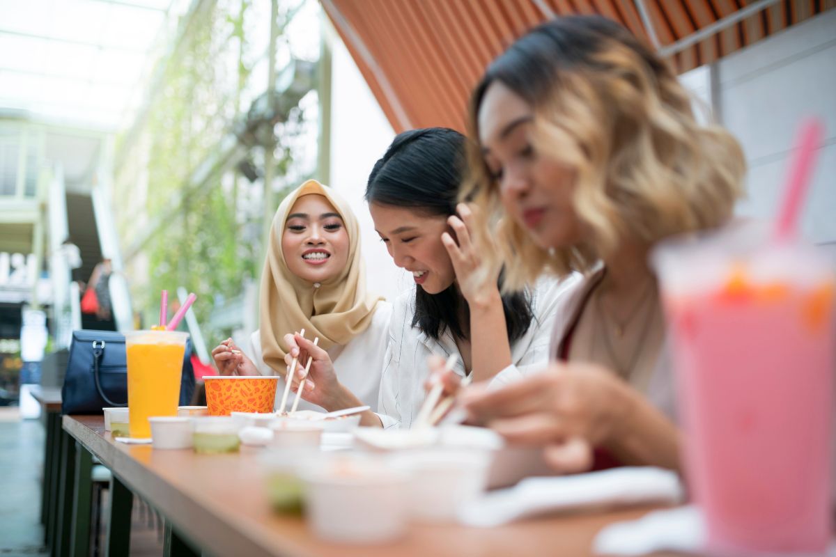 A group of Malaysian friends eating at a restaurant