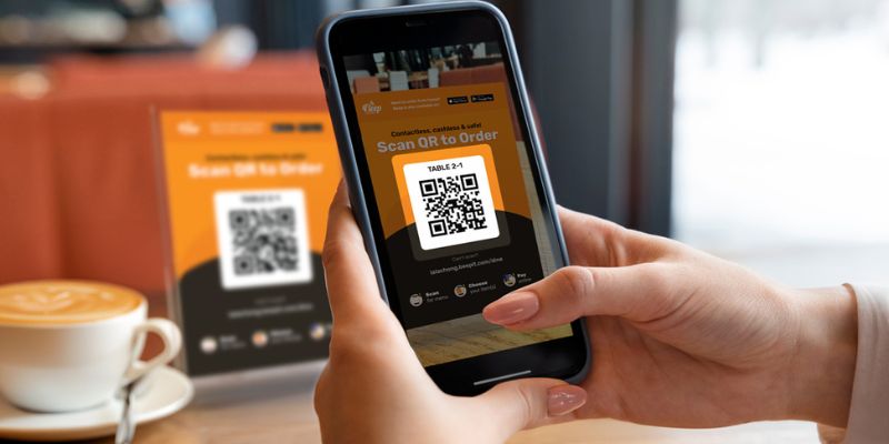 A person with the QR Order & Pay QR code