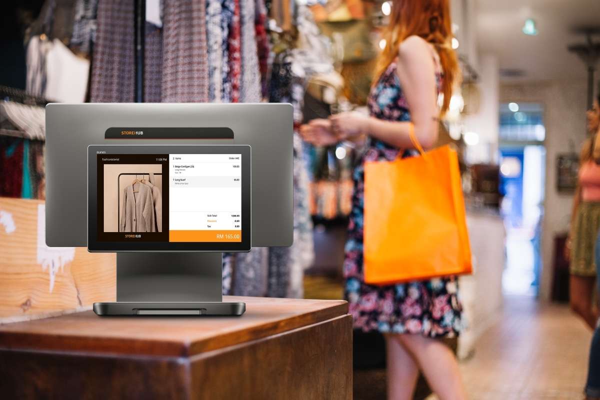 StoreHub POS system on the counter of a retail store.