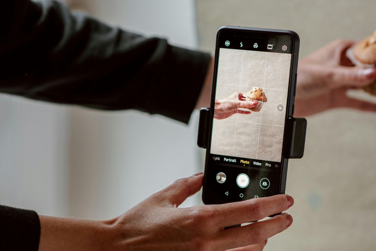 A Malaysian F&B business owner taking a photo of her product