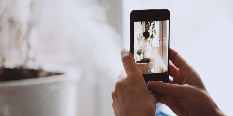 A Malaysian business owner taking a photo of one of our products